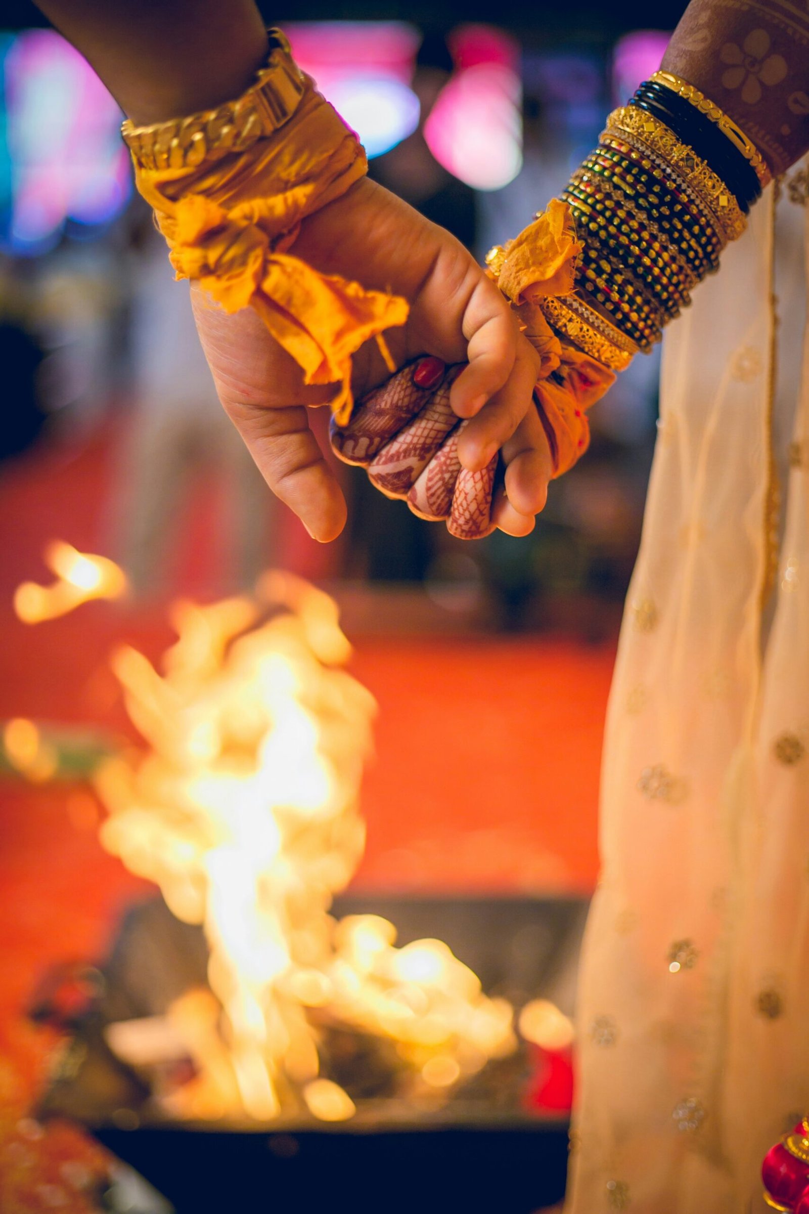 A couple in a cinematic outdoor portrait — golden light, soft expression